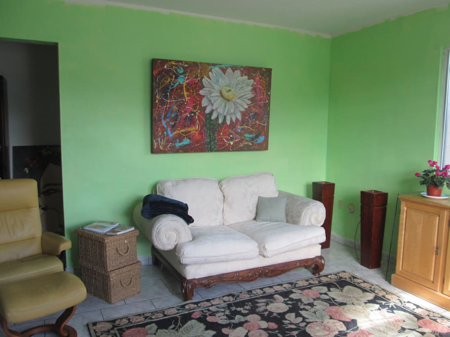 Beautiful Chaos by UGI Morales whose themes are vibrant flowers, blown out of proportion and exquisitely interpreted.