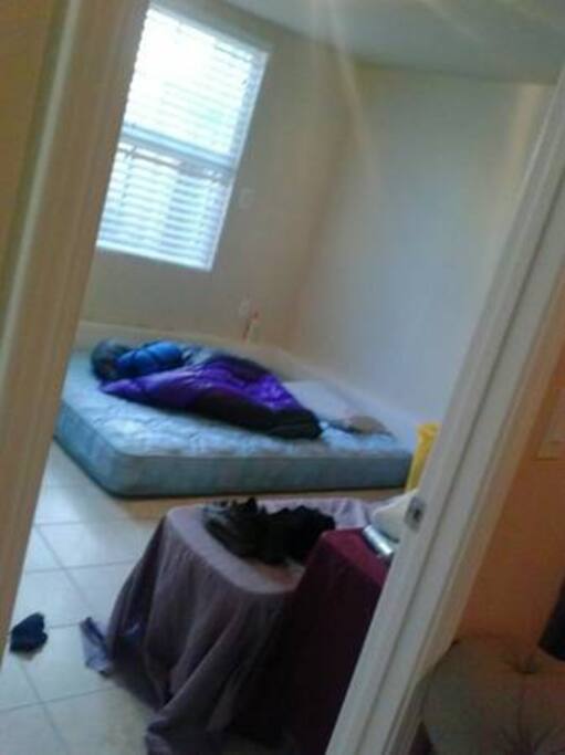 Prior to decorating my room. But, there's a queen mattress and a sunny vibe.
