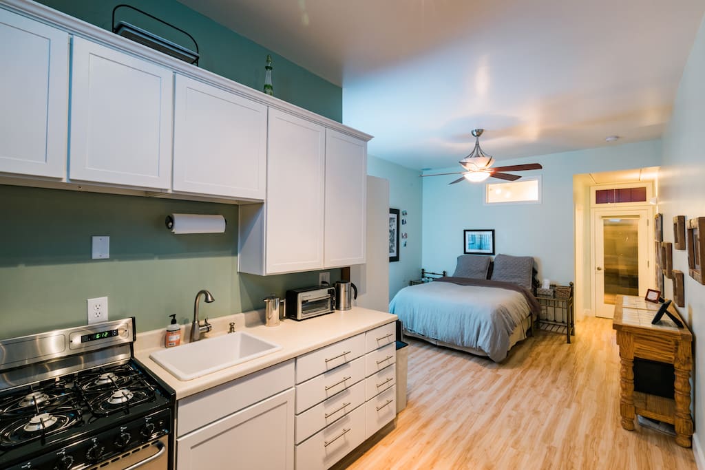 View of the entire space ~ bathroom is located behind the bed.