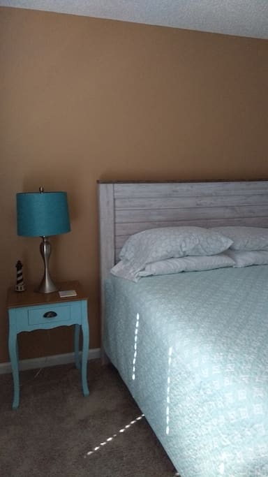 Reading lamp with side table for your convenience.