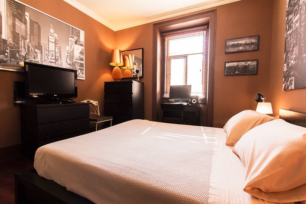 Full view of the bedroom with Cable TV and desktop PC