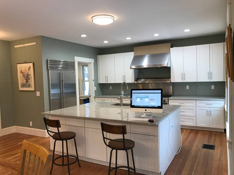 first floor is wide open end to end. This is obviously the kitchen area. 48 inch viking with a sub zero fridge...washer and dryer unit in the mudroom off of the kitchen