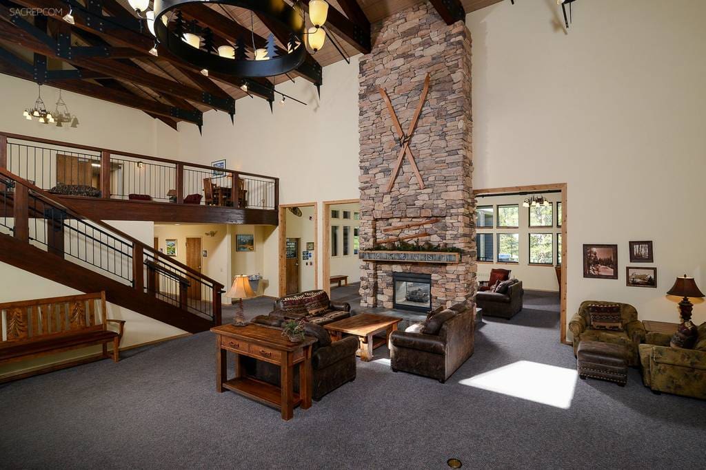 Part of the commons area, featuring comfortable seating for relaxation and a cozy fireplace to warm up by after a day on the slopes