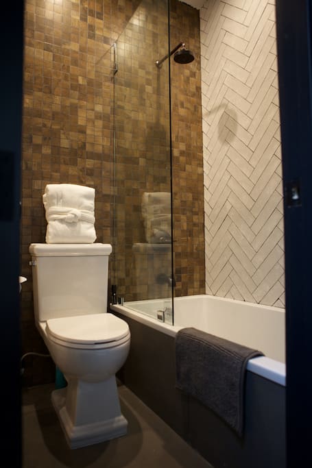 Your priviate modern full bathroom, right off the living room. Huge tub - bubble bath city!