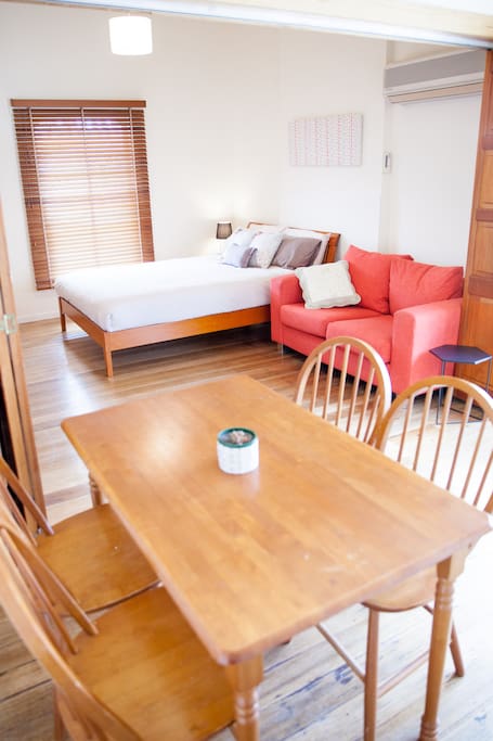 Dining table, couch and queen bed