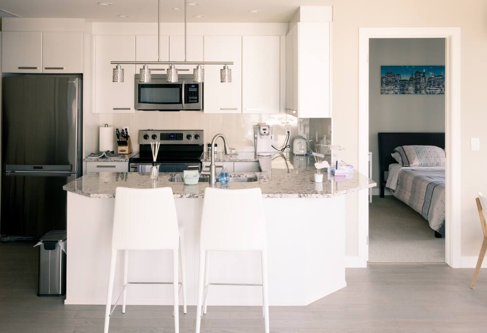 Kitchen area: full size stainless appliances, granite counters, KEURIG coffee maker.