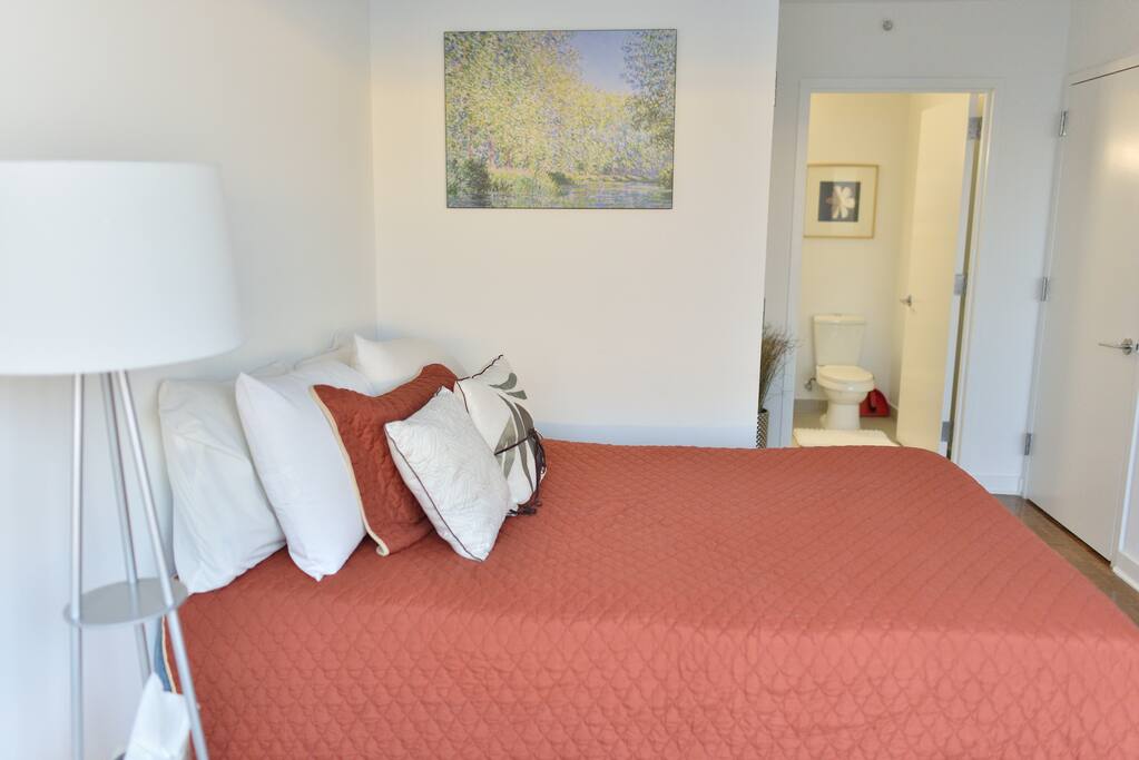 The Master Bedroom with en suite bathroom beyond the bedroom. Walk in closet - free for your use - inside of the room.