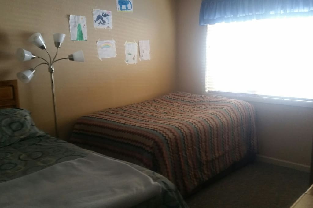 Master bedroom with queen and full sized bed