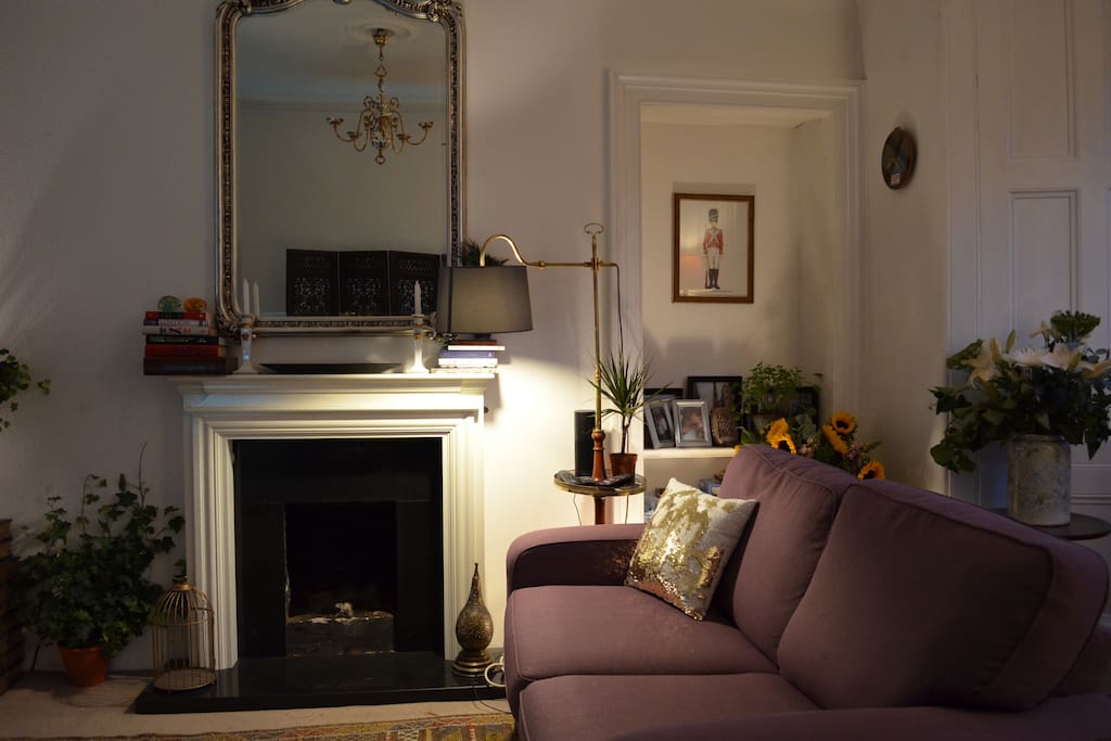 Living Room (Common Area). Please note: this sofa is also a sofa bed that is made available only to three-person bookings.