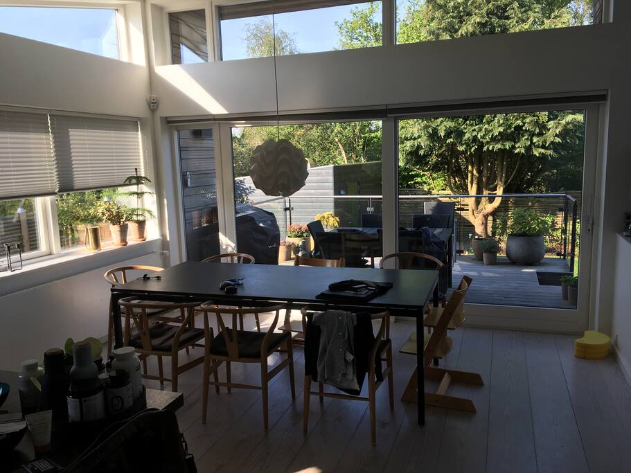 Dining table in open kitchen. The table can be extended to fit in 2-4 extra chairs.
