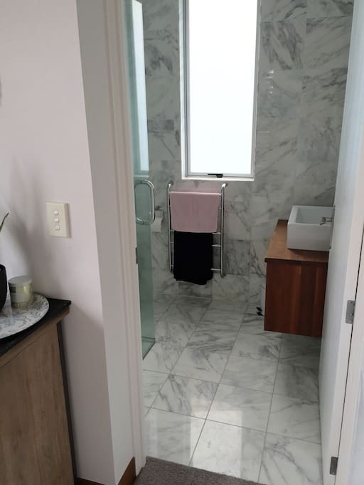 Separate marble en-suite bathroom