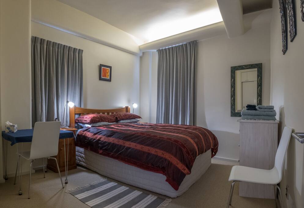 Queen size bed. Thermal lined curtains.
