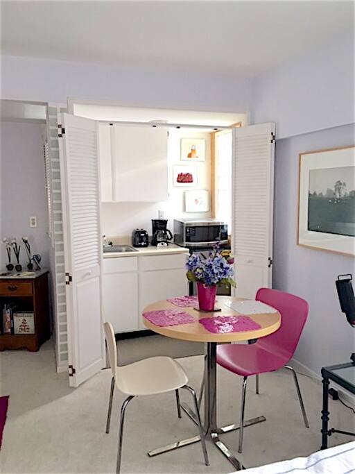 Dining area (with kitchenette doors open).