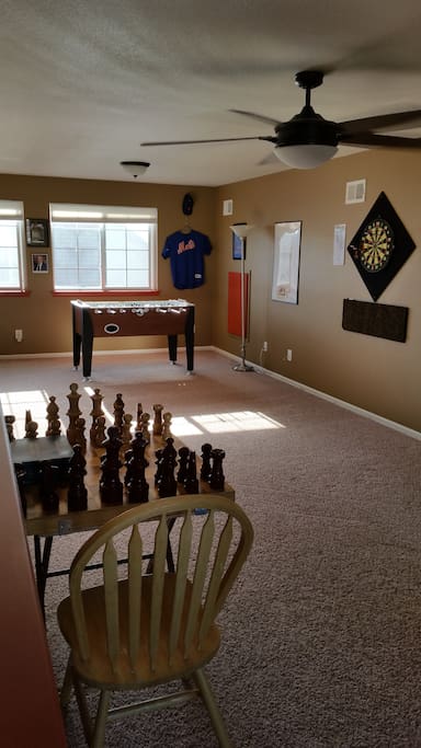FAMILY GAME ROOM WITH FOOSBALL, DARTS, AND GIANT CHESS BOARD