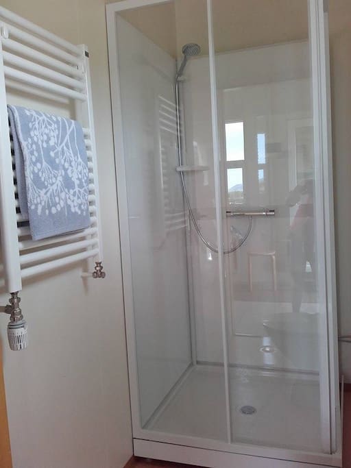 A shower, in the bathroom.
The hot water is geothermal and is moved to the house through pipes from a borehole at Laugar, 3km south of my house.