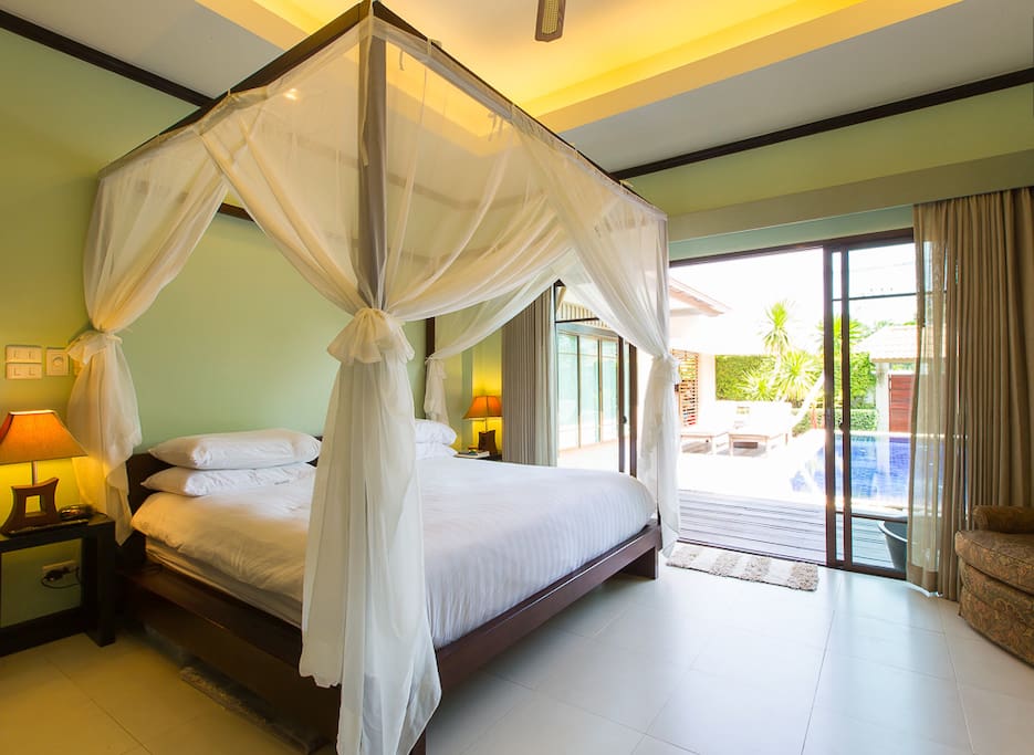 Master bedroom with direct access to your private pool, air conditioning, overhead fan, in-room suite, duel interior lit clothing closets, safe, flat panel T.V. et al...
