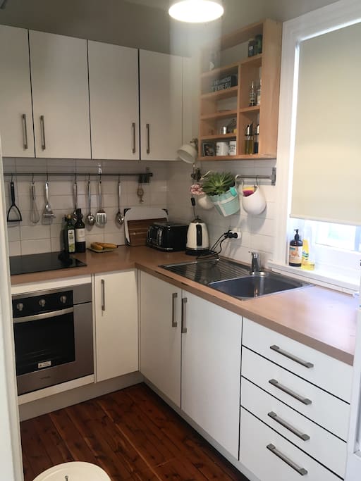 Kitchen with appliances such as kettle, toaster, microwave, oven, hob