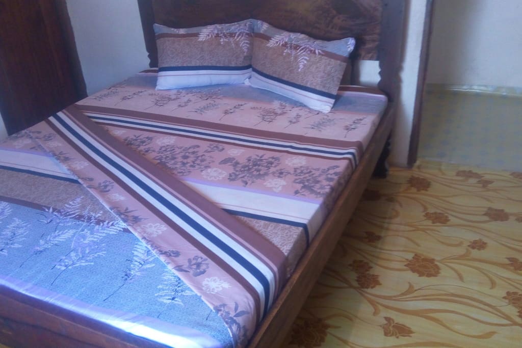 Queen size bed for bedroom one.
