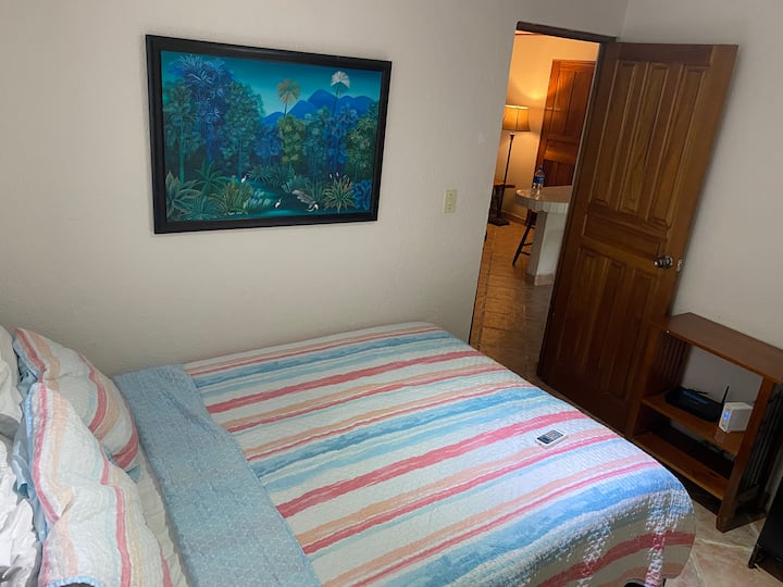 Single bed that has access to full bathroom and pool access