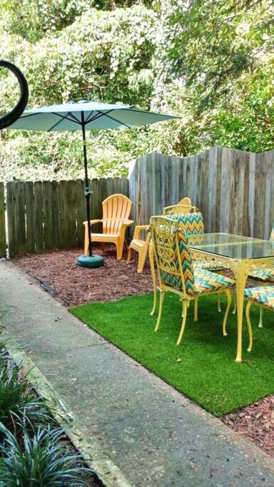 Relax under the umbrella or at the table.