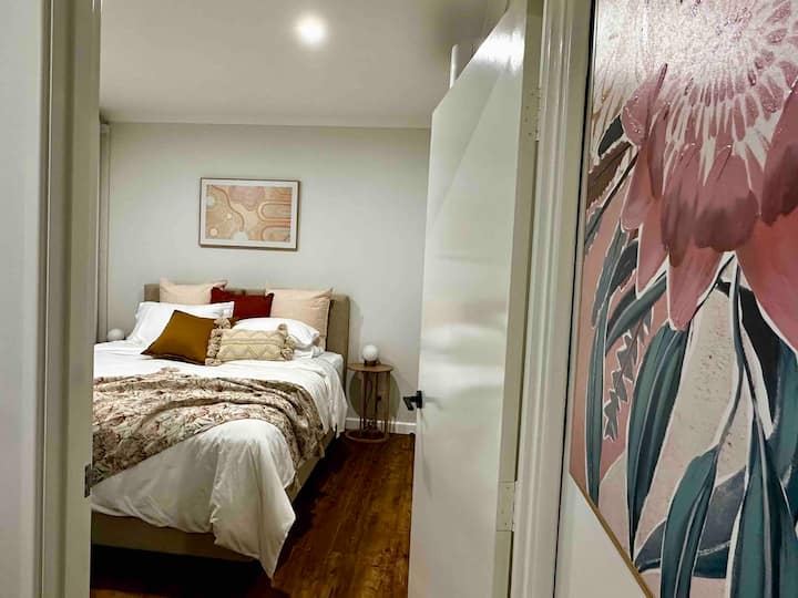 Bedroom 2 with accessible doorway. This room can be configured with a king size bed or two long single beds. If set up with two long single beds, the portacot can also be nicely positioned in this room. Portacot available by request.