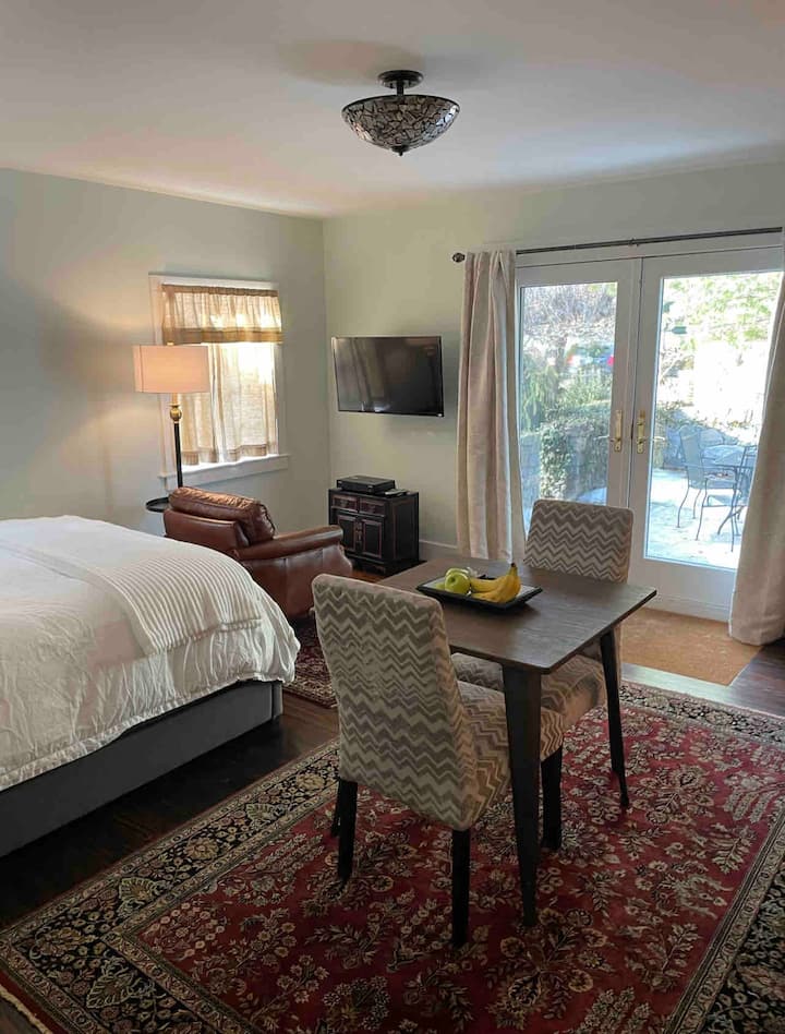 Ensuite studio bedroom with private patio access