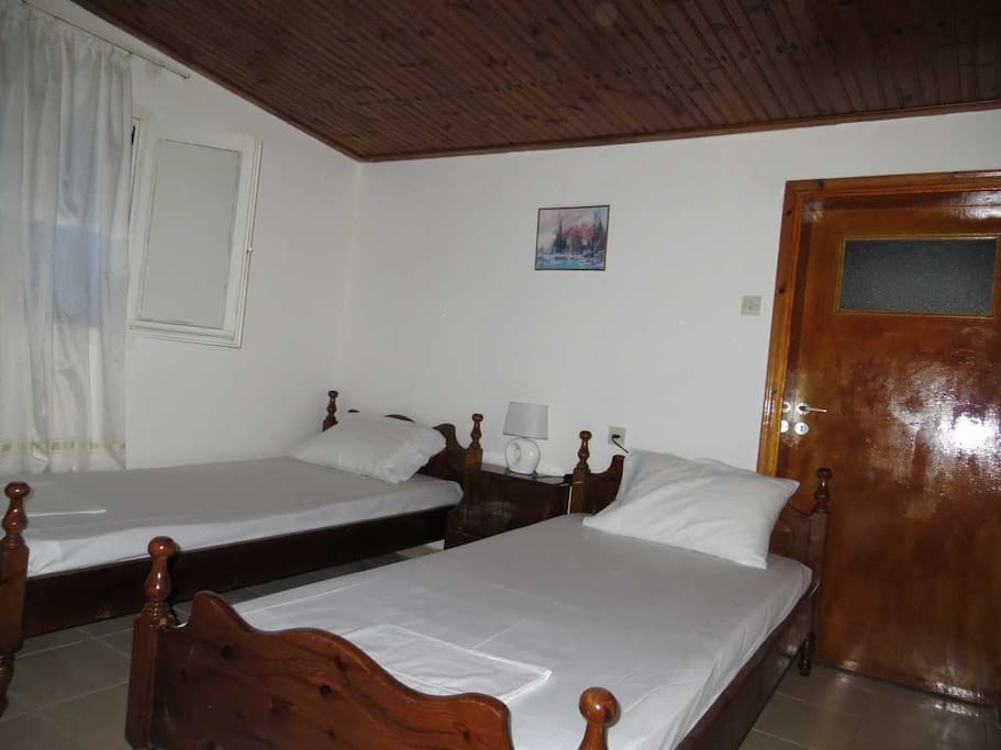 Each room has two (2) single beds. They can be arranged also side by side.
(This photo is from Room No 5)