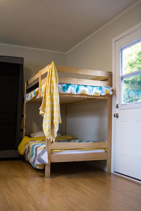 Residents sleep in four-person and six-person bedrooms. Each bunk comes with underbed storage bins, your own half-height closet space, and additional suitcase storage. All upper bunks have a bedside-table space.