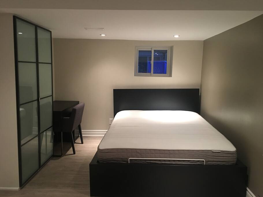 Comfortable bed with fresh linens to make this cozy unit feel like home
