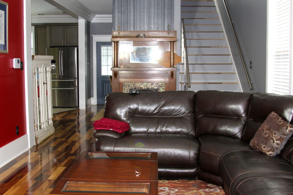living room with 50" tv and leather sofa