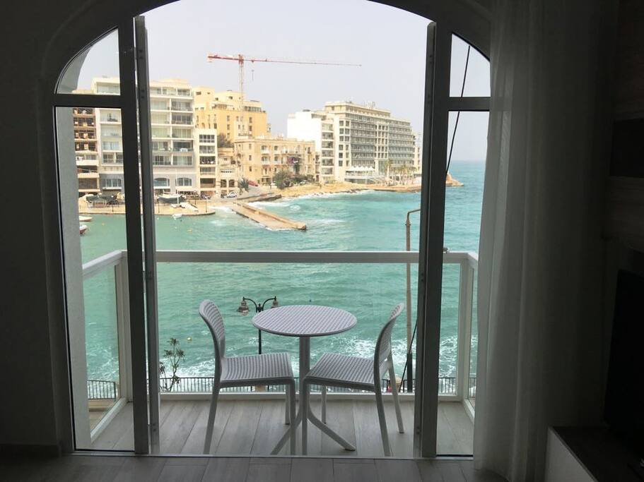 Kitchen / living / dining leading to sea-view balcony
