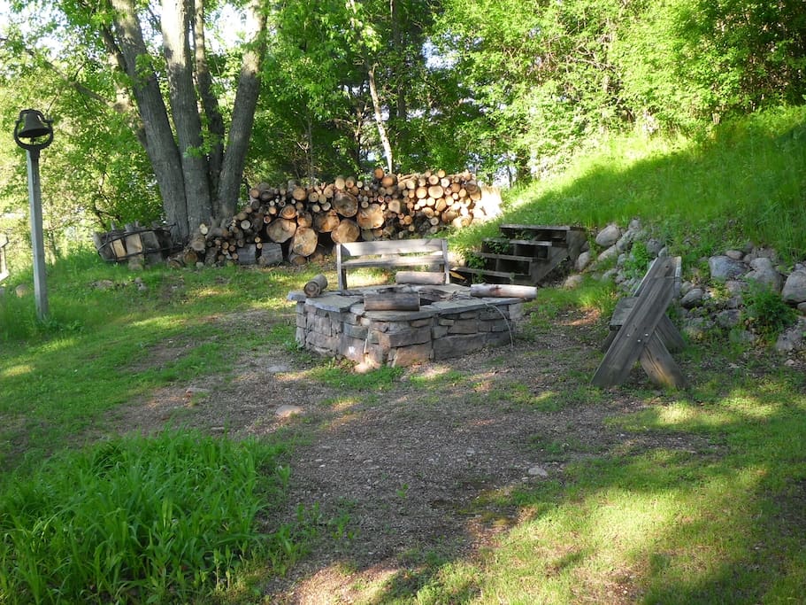 Out side fire place with wood provided.