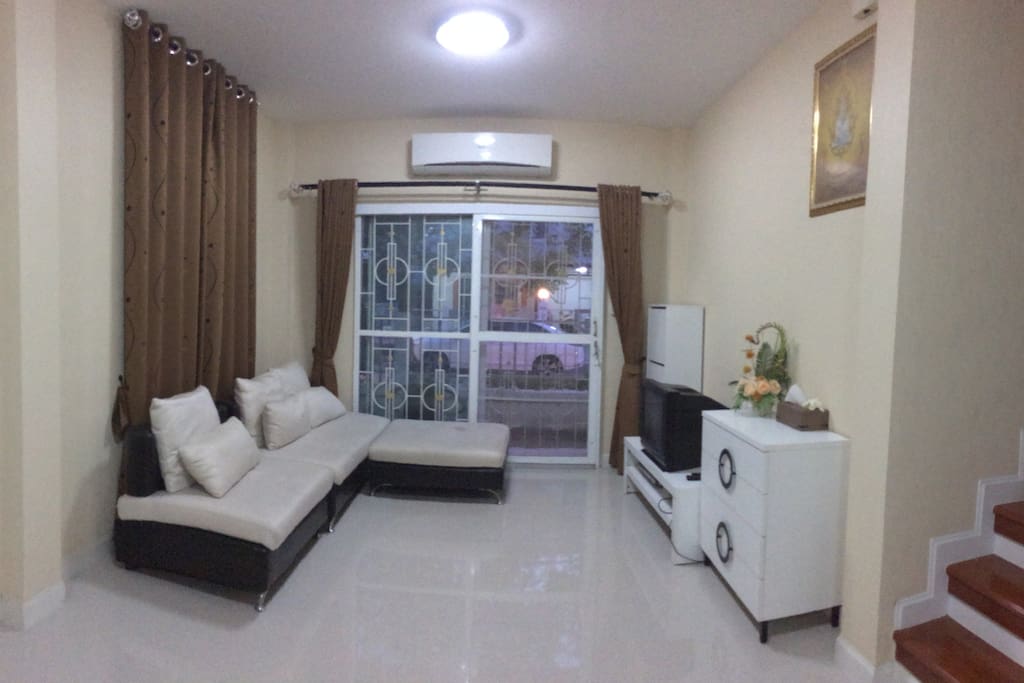 View of living room from inside house to the front door.