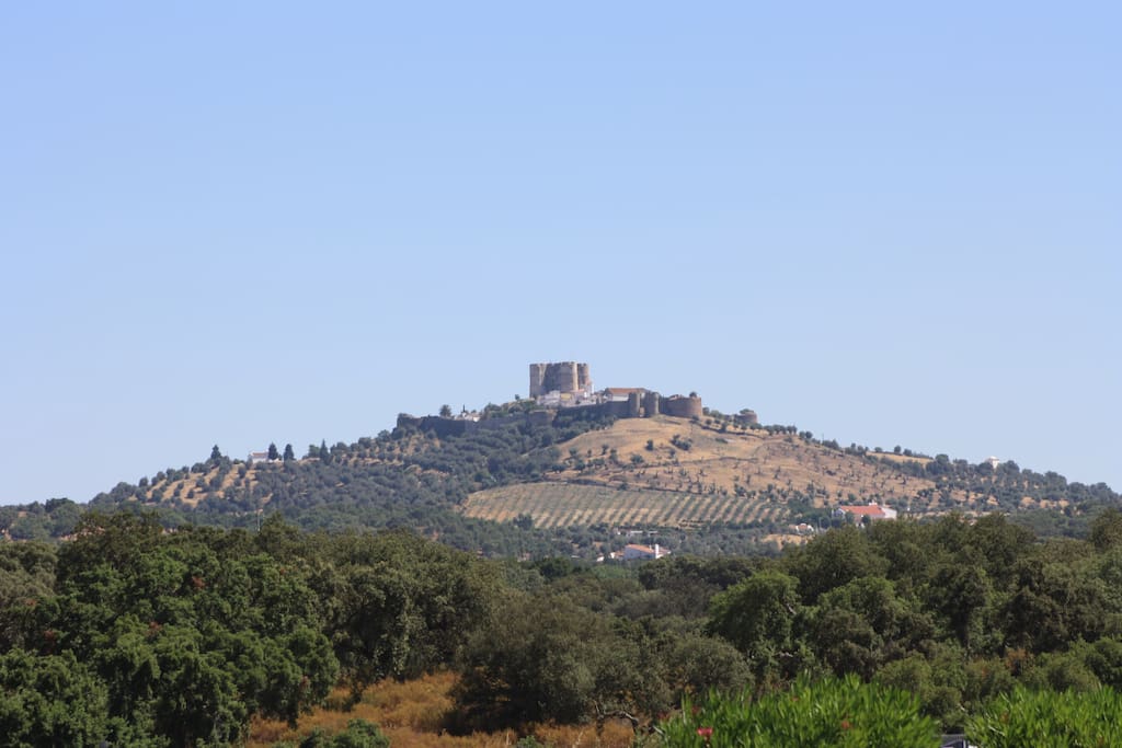 The hill, the walled Castle on top, we are next to the Castle