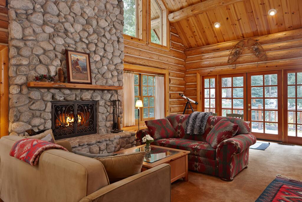 Living room with large fireplace, perfect for gathering.