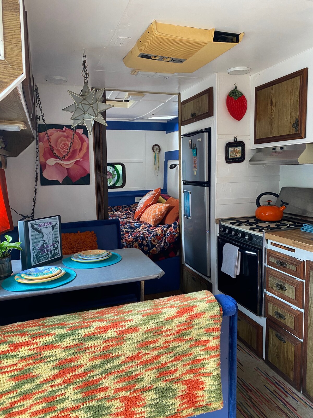 Kitchen and inside dining/work table...bedroom in the back