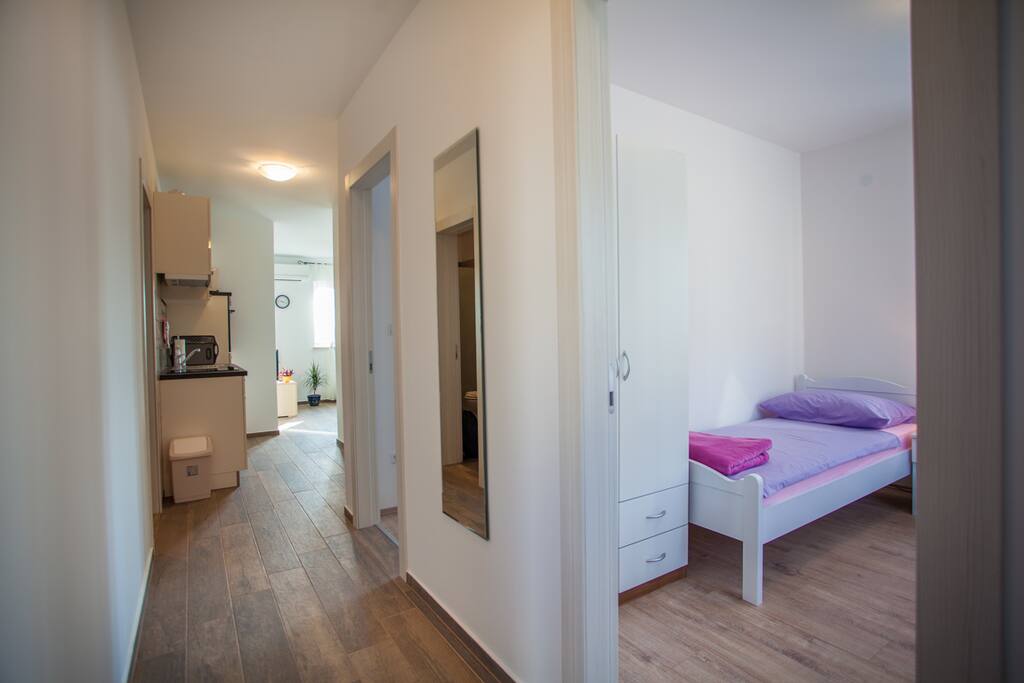 Hallway with a view to bedroom 2 and kitchen