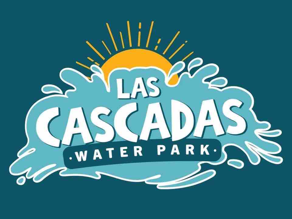 A colorful logo represents Las Cascadas Water Park, featuring bold lettering in white outlined against a vibrant blue background. Sun rays radiate from a golden sun above, while waves illustrated in light blue flow beneath the text, suggesting a fun and refreshing water experience.