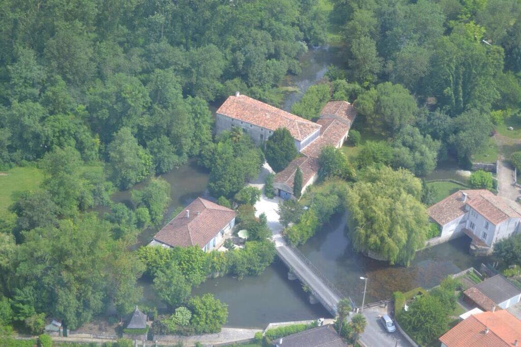 An aerial view of our beautiful property. The Millers house is on the left, and our renovated 14th century Mill is top centre. Our two gite cottages are in the connecting building on the right. the mill.