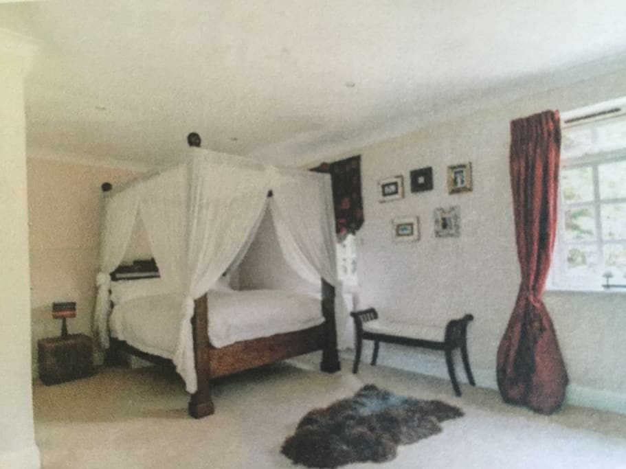 Queen size guest bedroom with double wardrobe.