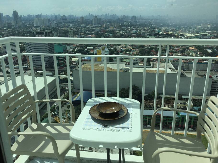 Covered balcony with view of the city... Perfect for a romantic dinner with your partner.