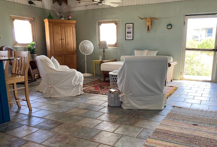 The living room is cozy, and the house is very spacious.