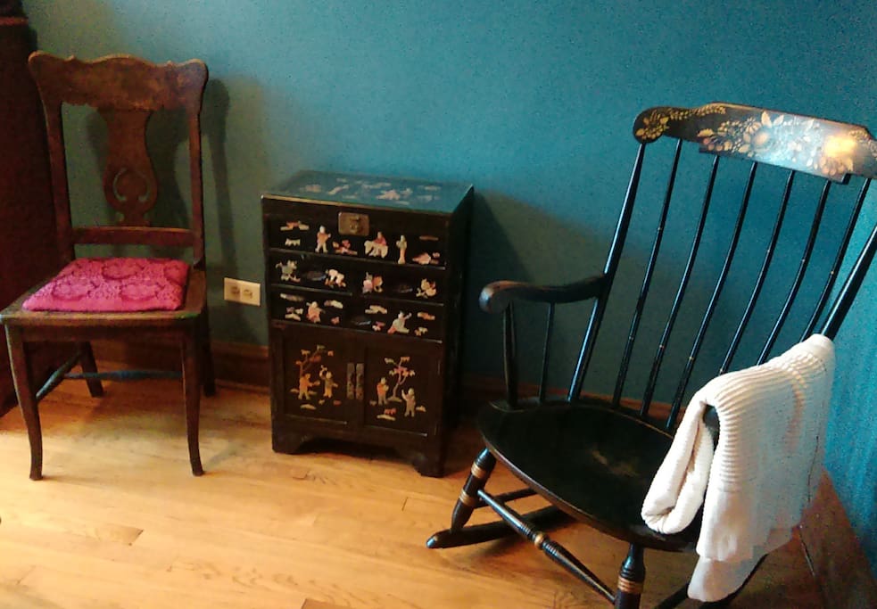 Two chairs for sitting. . . or stashing stuff. The rocking chair and chest have been in Gin's family a long time.