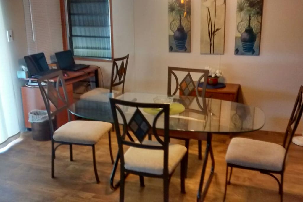 Dining room has seating for 6 plus a desk for those who need a mini work area.