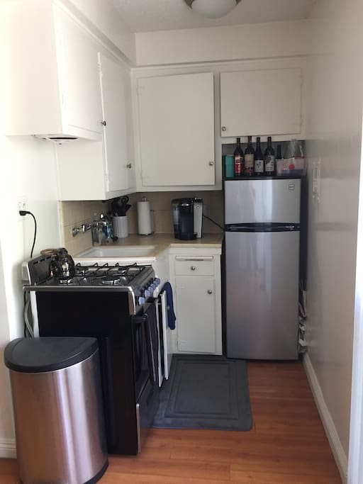 Kitchen is small but has all the amenities you will need to include stove, refrigerator, microwave, and Keurig. All silverware and cookware are able to be used.