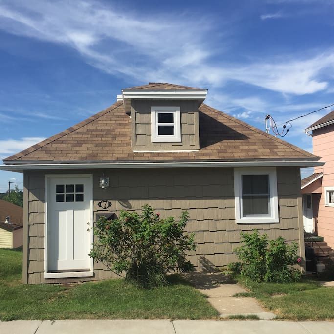 Adorably finished in cedar shake, this house is the cutest on the block!