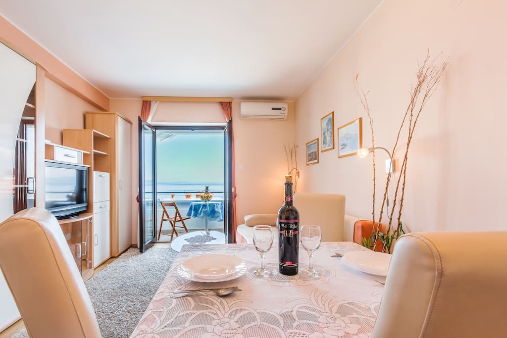Living room and balcony with panoramic sea view