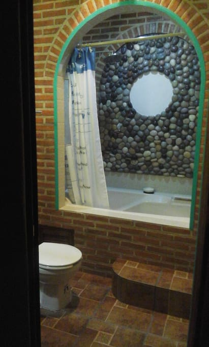 jacuzzi hot tub in bathroom.
