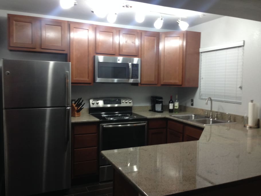 Kitchen: granite countertop and stainless steel appliances. Coffee maker,