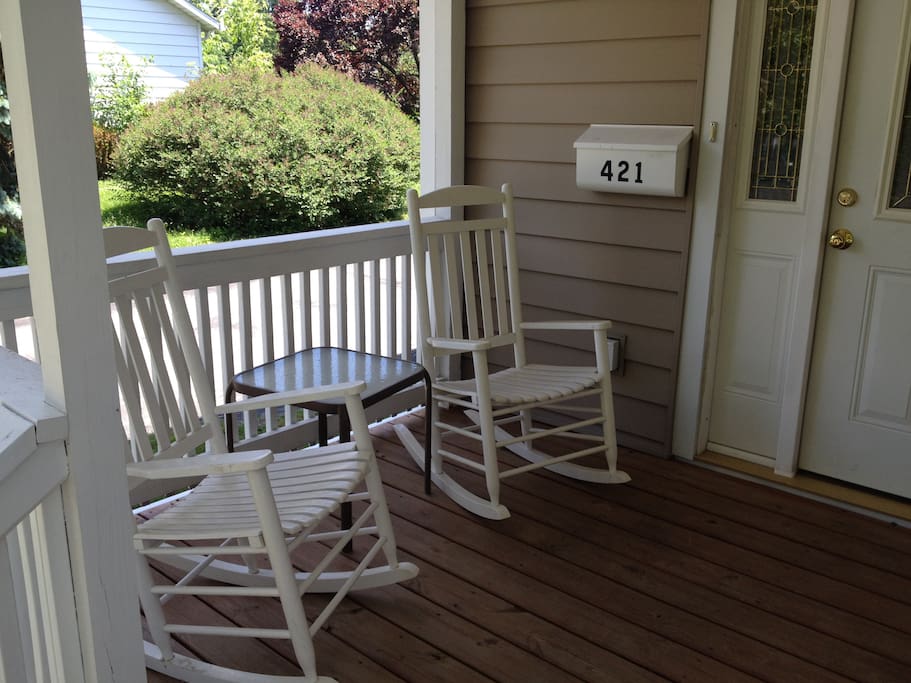 The front porch has seating to enjoy conversation and morning coffee.